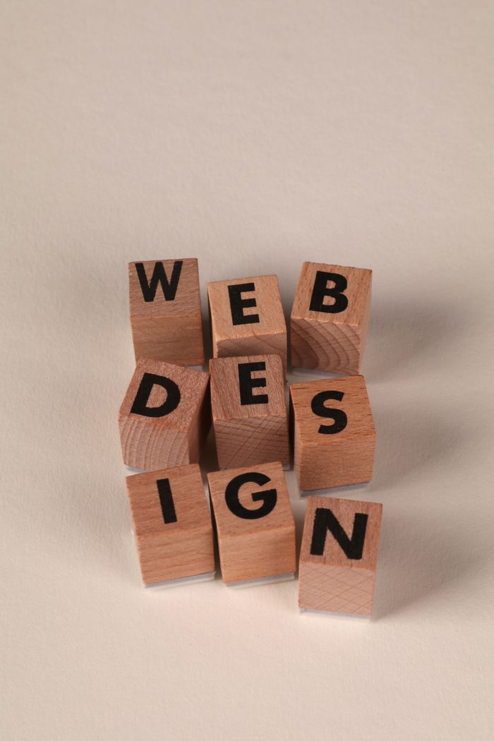 creative-03 Wooden blocks arranged to spell 'Web Design'. Perfect for creative, digital content themes.